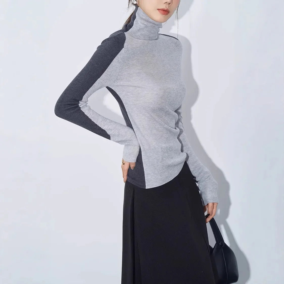 Topp med kontrasterande ärm och falsk halsringning 4